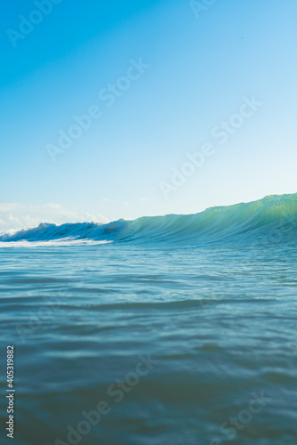 Breaking Waves and spray  white water and light reflected on the surface of the water