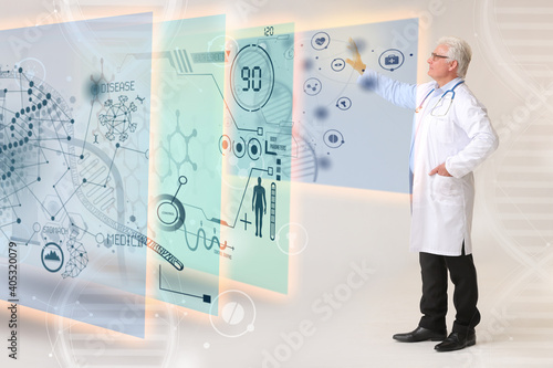 Mature male doctor using vi...