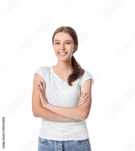 Happy young woman with crossed arms on white background © Pixel-Shot