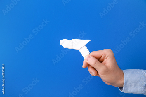 Male hand with paper dove o...