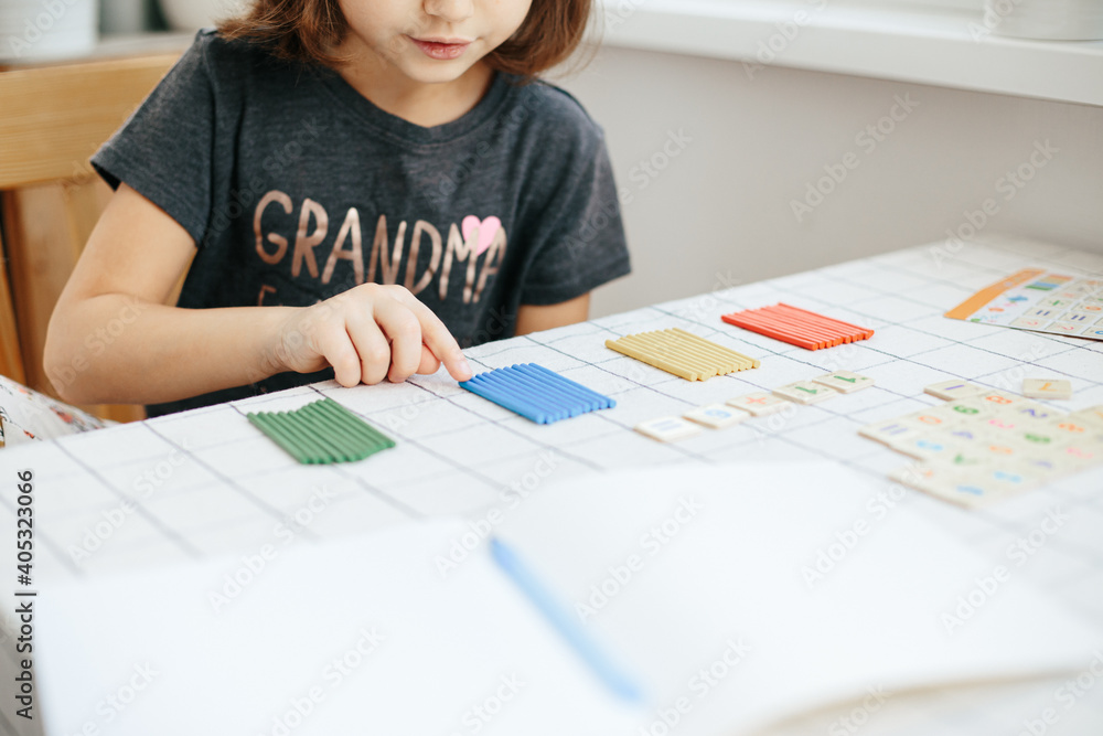 Cute five years girl learning home.