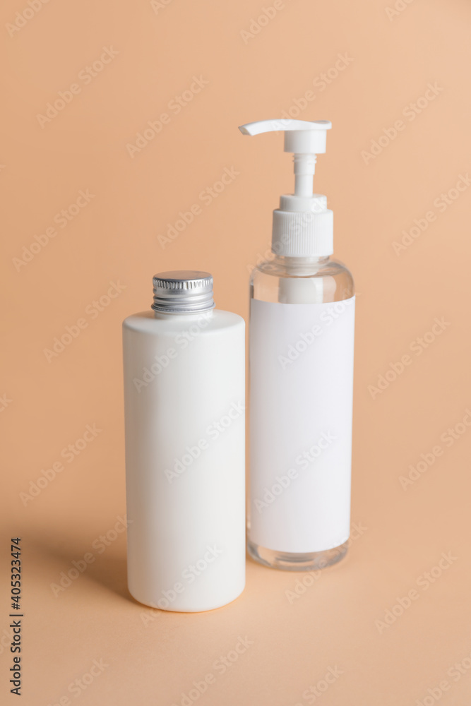 Different bottles of cosmetic products on color background - obrazy, fototapety, plakaty 