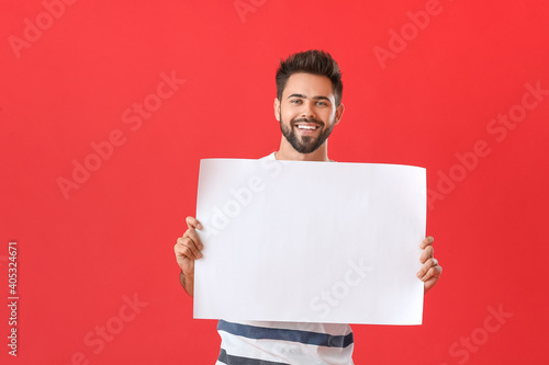 Young man with blank paper ...