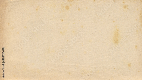 Old paper vintage brown or beige retro design background with damaged, weathered dirty surface. A rustic grungy textured material like a blank horizontal parchment page, an empty manuscript texture