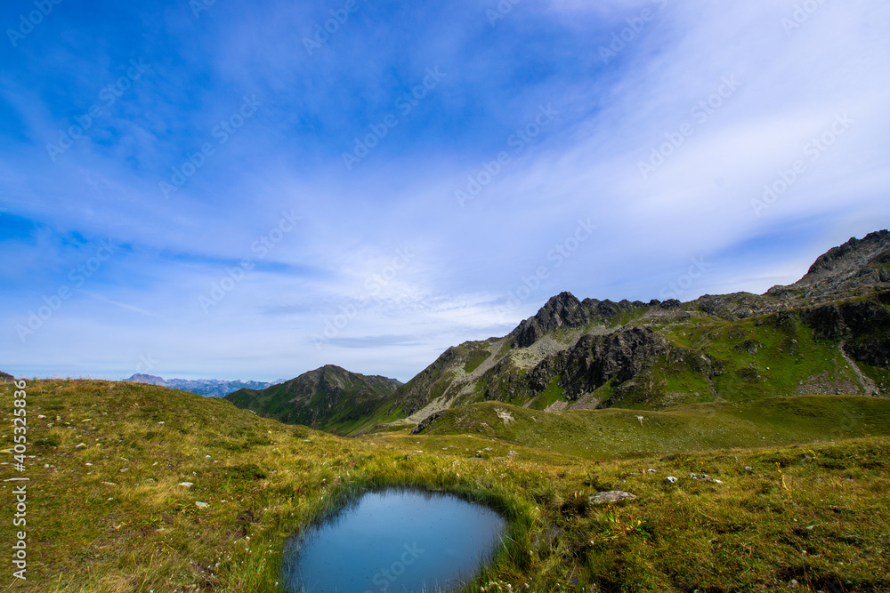landscape with lake and blue sky in the mountains (Montafon, Vorarlberg, Austria)