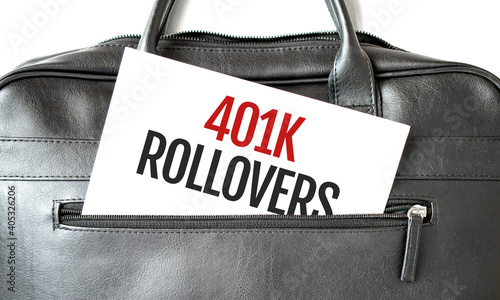 Text 401k ROLLOvERS writing on white paper sheet in the black business bag. Business concept photo