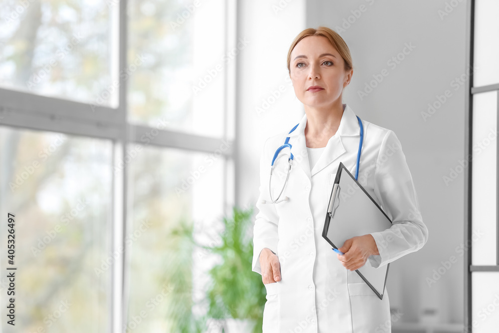 Portrait of female doctor in clinic