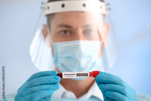Scientist with sample of co...