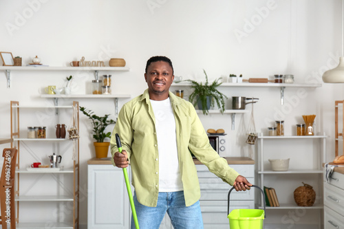African-American man moppin...