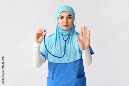 Female Muslim doctor with s...