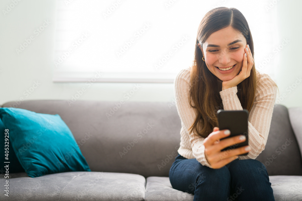 Romantic girlfriend is sending a text to her boyfriend Romantic girlfriend is sending a text to her boyfriend