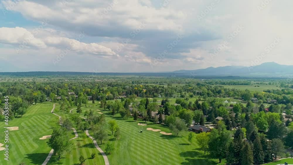 WS AERIAL Green landscape with mountains in background WS AERIAL Green landscape with mountains in background