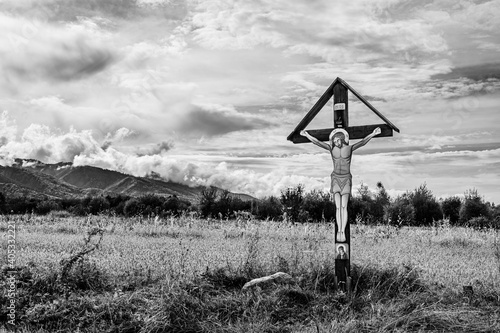 Traditional orthodox cross on a field on the side of the road in Transylvania countryside, Romania