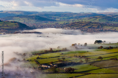Beautiful rural farmland partially covered in low hanging fog