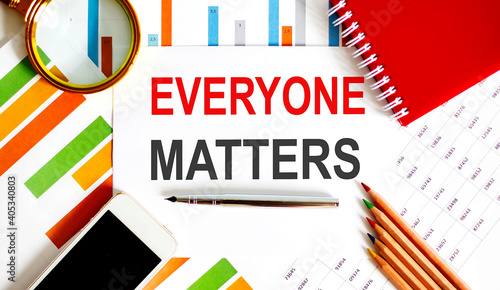 Everyone Matters text on paper with office background
