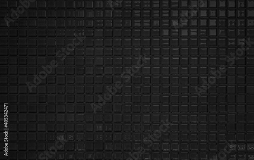 Black tile wall high resolution real photo or brick seamless  pattern and texture interior room background. Dark grid tiles wall texture for the decoration of the bedroom  Home or office backdrop.