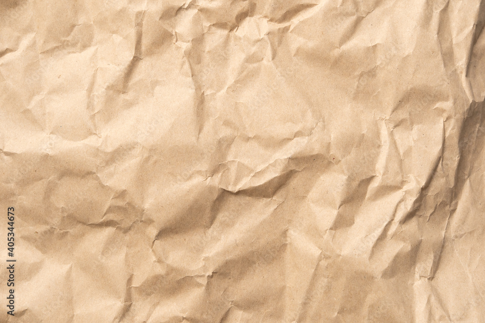 Crumpled brown paper texture perfect for background structure. Packaging material with rough wrinkles. The grunge textured surface is a vintage backdrop. Crumpled brown paper texture perfect for background structure. Packaging material with rough wrinkles. The grunge textured surface is a vintage backdrop.