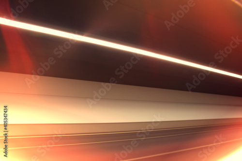 Fast moving light in tunnel. Dynamic and Abstract background with black space created in camera with lines of red and white spectrums of light crossing to achieve a sense of movement. Stock Photo.