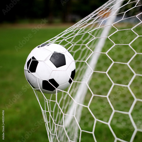 Close-up Of Soccer Ball On Net