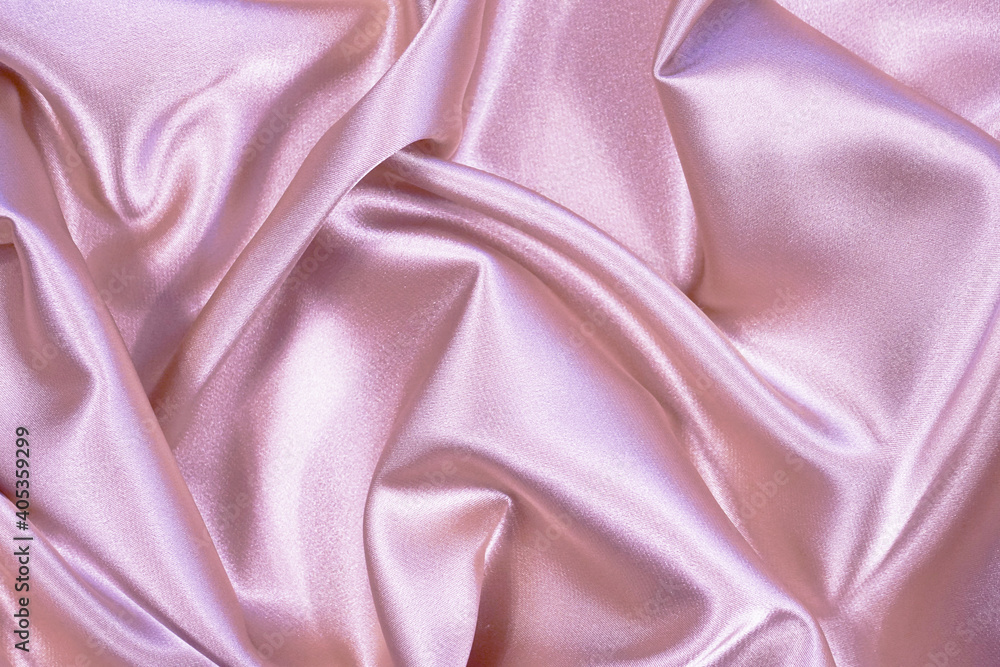 Pink silk satin background. Soft wavy folds on the fabric. Wedding, anniversary, valentine, love, tender, holiday, celebration, card. Beautiful pink abstract background with copy space for your design Pink silk satin background. Soft wavy folds on the fabric. Wedding, anniversary, valentine, love, tender, holiday, celebration, card. Beautiful pink abstract background with copy space for your design
