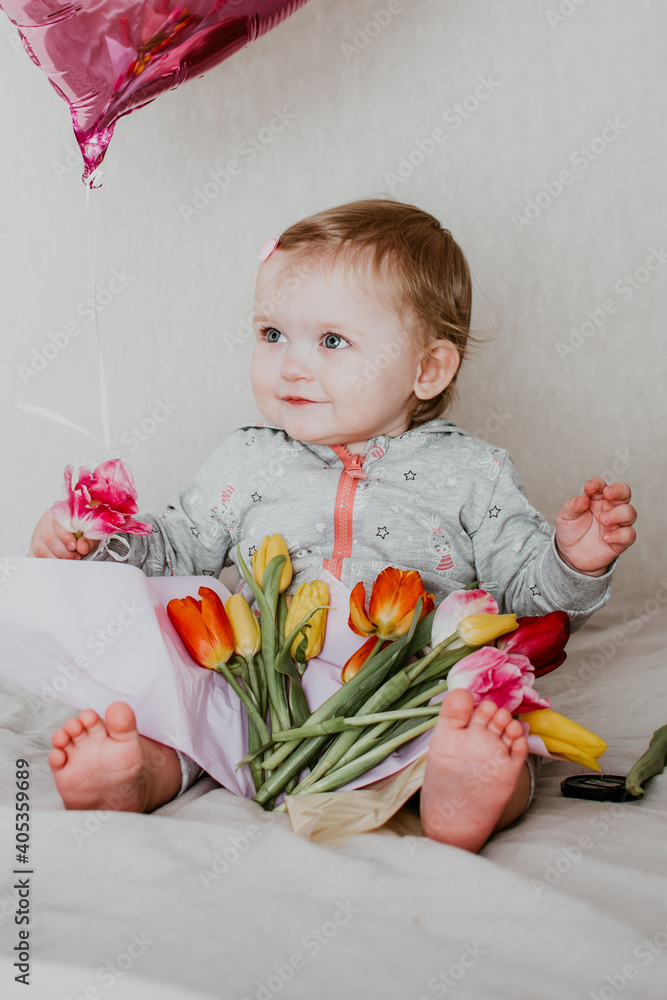 child with ball and tulips child with ball and tulips