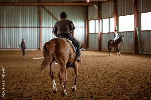 Young woman is engaged in equestrian sports