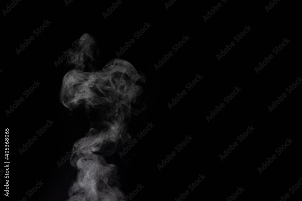 Figured smoke on a dark background. Abstract background, design element, for overlay on pictures. Figured smoke on a dark background. Abstract background, design element, for overlay on pictures.