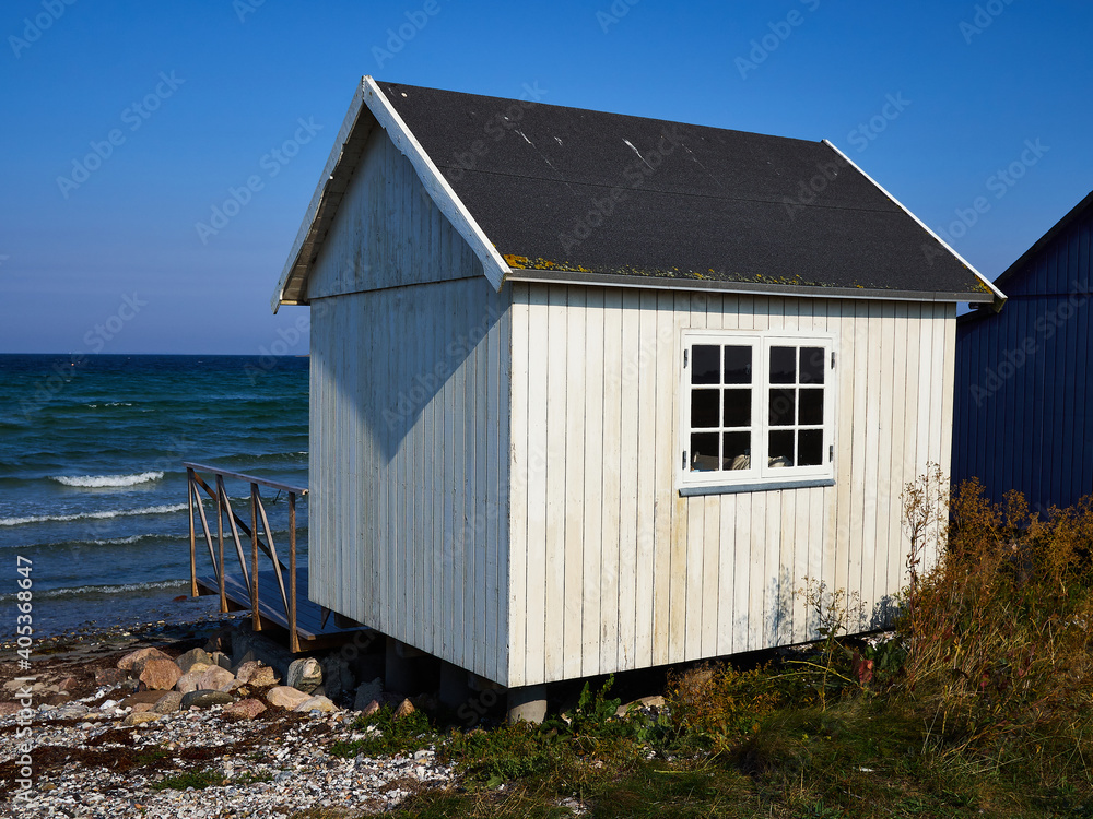 Beautiful cute little wooden beach huts summer houses, painted in lively colors, Aero Island, South Funen, Denmark Beautiful cute little wooden beach huts summer houses, painted in lively colors, Aero Island, South Funen, Denmark