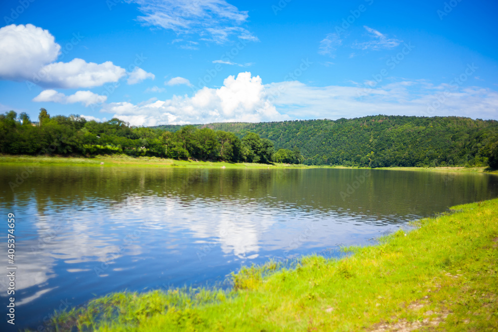 Beautiful view over the river Dniester on a sunny summer's day. Outdoor recreation. Fishing adventures, carp fishing. Swimming, summer vacation, outdoor activities, place for picnic.