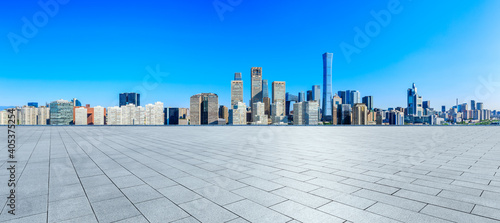 Empty square floor and modern city commercial buildings in Beijing,China.
