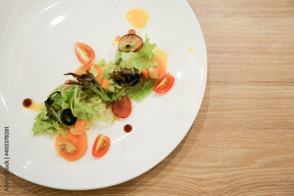 Fresh healthy salad and vegetable on a white plate. Fresh healthy salad and vegetable on a white plate.