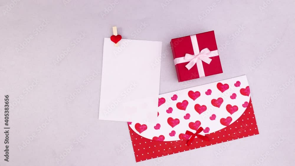 Paper for text come out of envelope and gift appear for valentine's day. stop motion