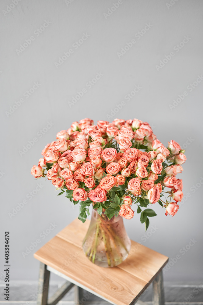 pink rose branch in a vase . Summer background. Bouquet of roses present for Mothers Day. Photo of Flowers for a catalog of flower online store and delivery. pink rose branch in a vase . Summer background. Bouquet of roses present for Mothers Day. Photo of Flowers for a catalog of flower online store and delivery.