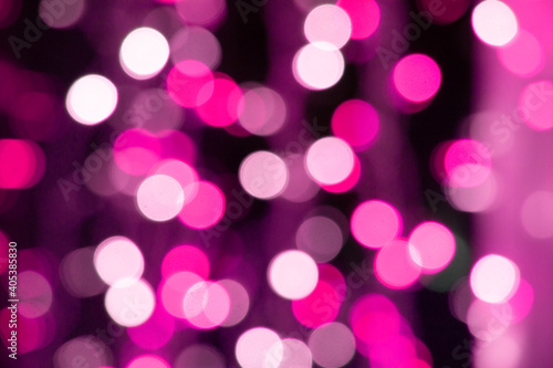 Abstract pink bokeh texture on black background