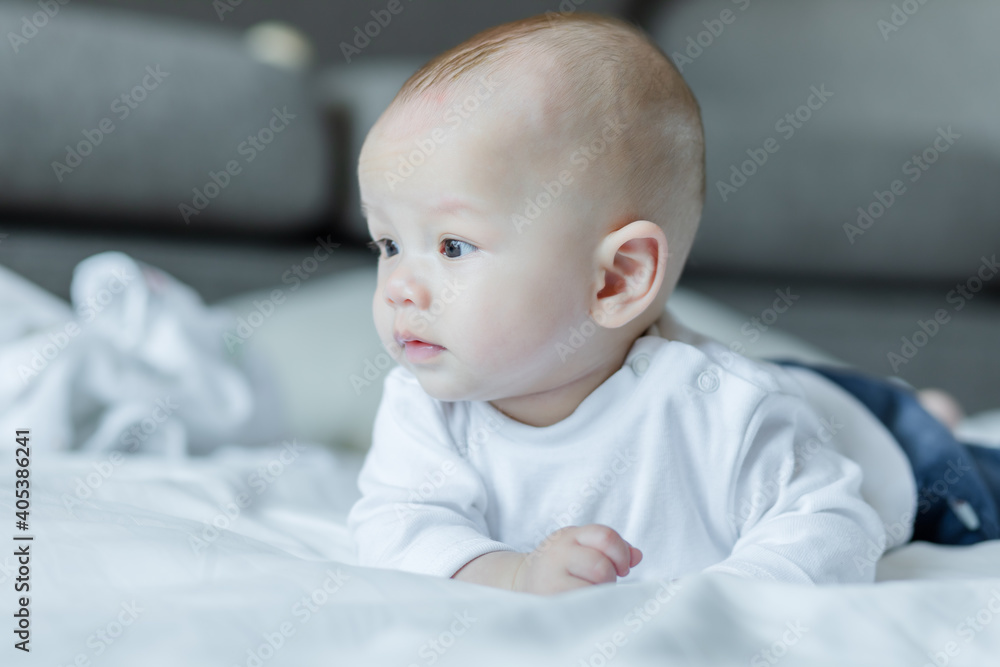 Cute baby on white bed. Baby, newborn concept. Cute baby on white bed. Baby, newborn concept.