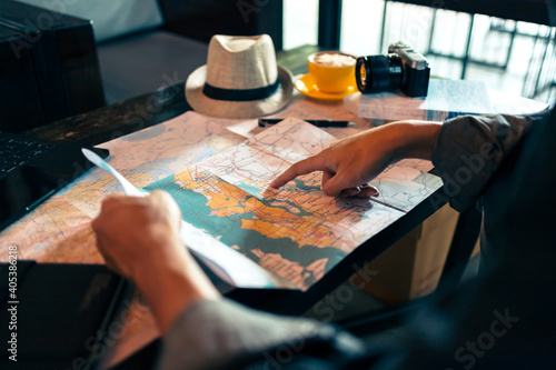 Bild auf Leinwand Tourist planning vacation with map and other travel accessories on the table