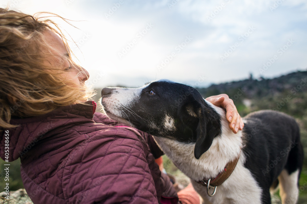 Girl playing with a dog while traveling Girl playing with a dog while traveling