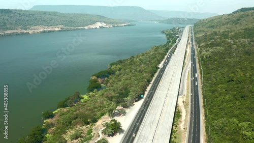 Scenic aerial view of big highway, Top view from drone of road and green forest mountain  photo