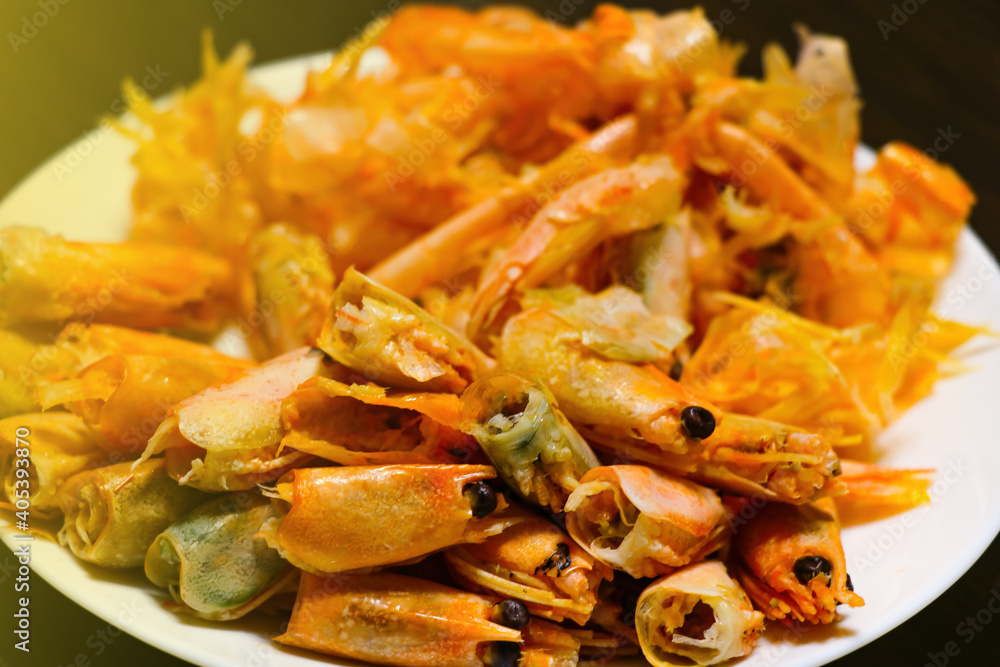 Delicious shrimp heads on a plate after eating. Delicious shrimp heads on a plate after eating.