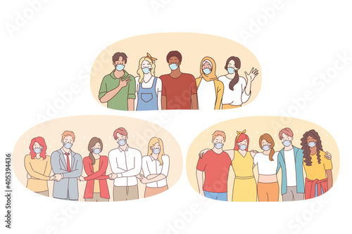 Teamwork, unity, protective masks during coronavirus pandemic concept. People business partners or students friends in medical face masks standing and holding hands as symbol of uniting efforts 