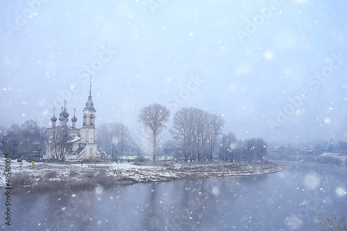 winter landscape church on the banks of the freezing river in vologda, christianity baptism russia christmas