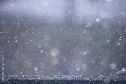 blurred background snowfall nature, abstract falling snowflakes design © kichigin19