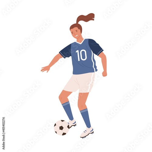 Young female soccer player kicking ball forward. Woman playing football in bl...