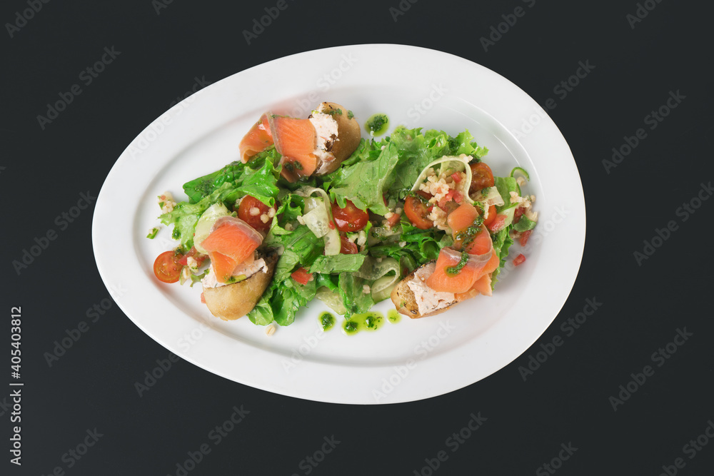 a plate of delicious salad on a black background a plate of delicious salad on a black background