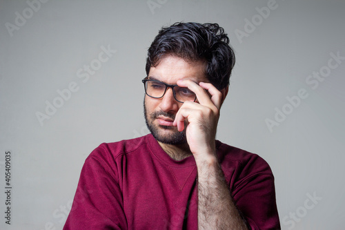 A man looking sideways with deep thinking