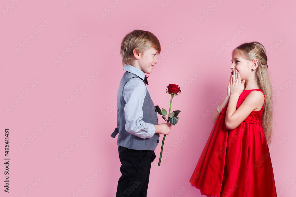 Valentines day surprise. Little boy in love giving cute girl red rose , Valentines day surprise. Little boy in love giving cute girl red rose ,