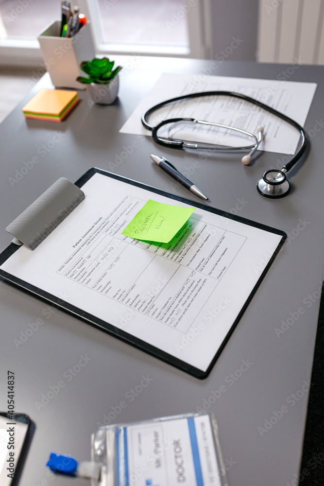 Doctor desk with medical documents and stethoscope Doctor desk with medical documents and stethoscope