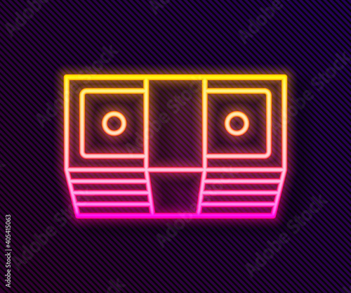 Glowing neon line Bribe money cash icon isolated on black background. Money banknotes stacks. Bill currency. Vector.