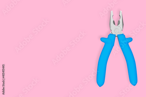 Metal pliers with rubber grips Background on the theme of tools, repair or maintenance of equipment.