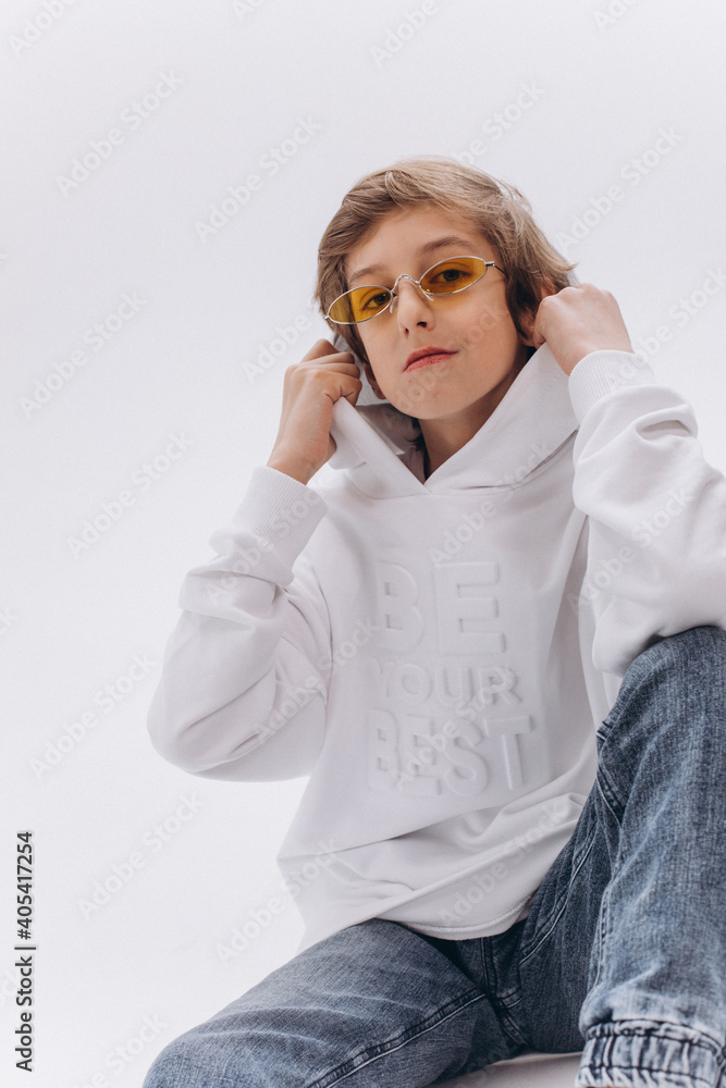 Stylish caucasian teenager boy on white background posing Stylish caucasian teenager boy on white background posing